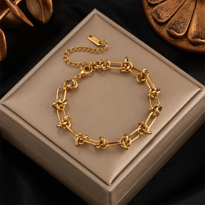 Set Collar y Pulsera Nudo Trenzado – Acero Inoxidable Dorado/Plateado
