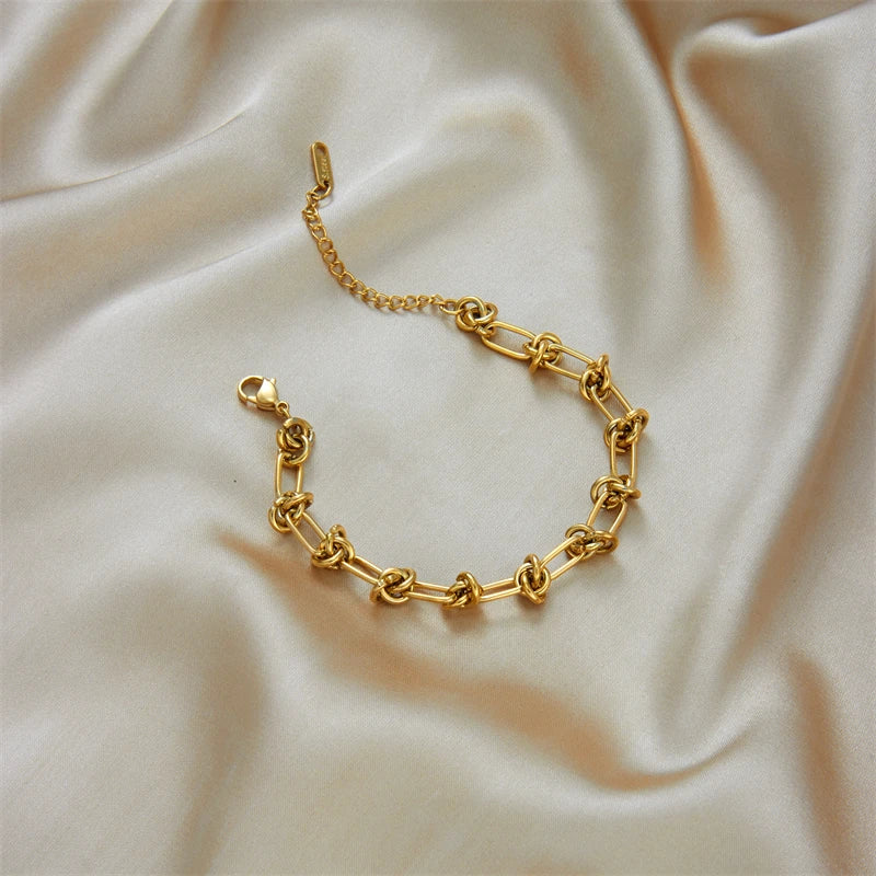 Set Collar y Pulsera Nudo Trenzado – Acero Inoxidable Dorado/Plateado